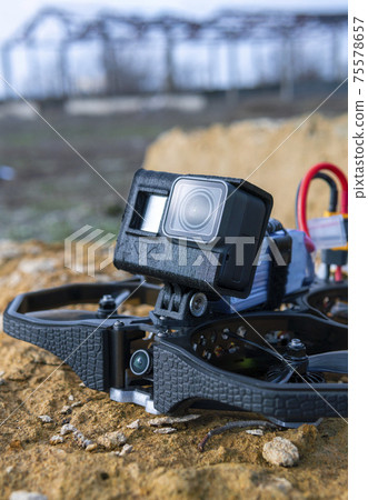 A Brand-New Modern Cinewhoop Iflight Protek 35 with GoPro Action Camera on Board Outdoors in the Grass A Brand-New Modern Cinewhoop Iflight Protek 35 with GoPro Action Camera on Board Outdoors in the Grass 75578657