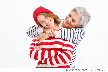 Loving daughter and mother in trendy outfits 75579172