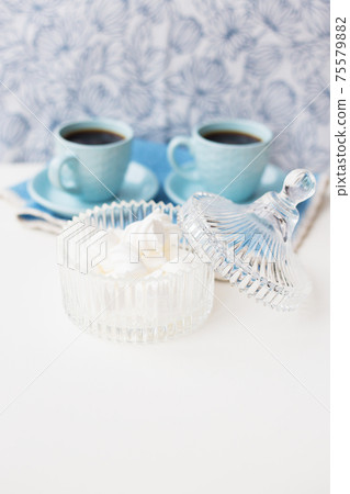 saucer with marshmallows in the background two cups of coffee 75579882