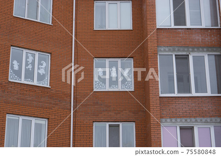paper cutout Christmas decorations glued to windows paper cutout Christmas decorations glued to windows 75580848