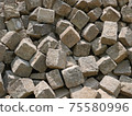 Pile of gray street paving mostly cubic shape before stealing the road surface 75580996