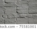 Detail of old brick exterior many times painted wall, gray color 75581001