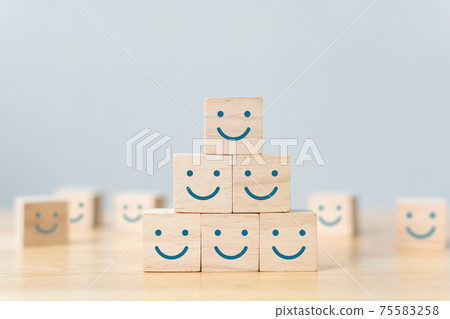 Wooden cube block shape with icon face smiley 75583258