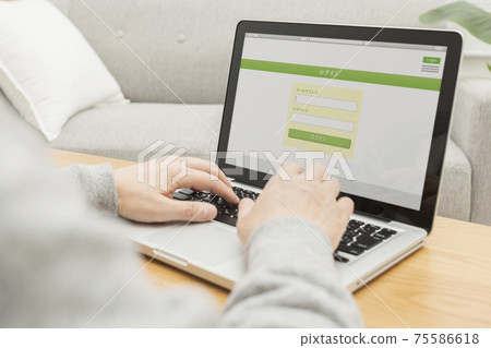 A man opening a login screen on his computer 75586618
