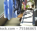 Laundry dried on the balcony of the apartment 75586865