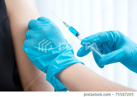 Male doctors vaccinated with syringes to prevent epidemics at hospitals, health care, and medical concepts Male doctors vaccinated with syringes to prevent epidemics at hospitals, health care, and medical concepts 75587205