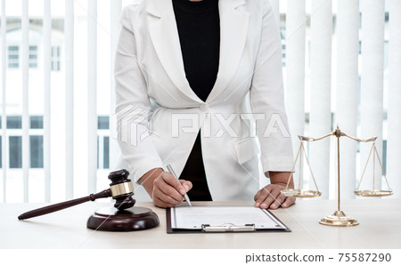 Professional women lawyers work at a law office There are scales, Scales of justice, judges gavel Professional women lawyers work at a law office There are scales, Scales of justice, judges gavel 75587290
