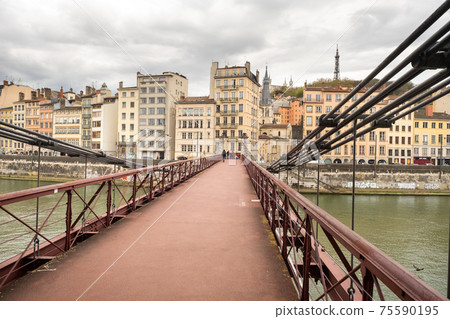 LYON, FRANCE-APRIL 7, 2019: the Passerelle Paul Couturier Bridge in the Saone River 75590195