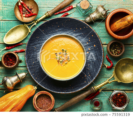 Pumpkin soup and pumpkins 75591319