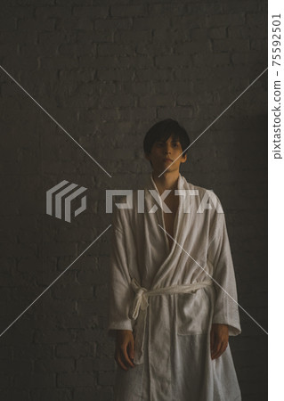 Young man in a bathrobe 75592501