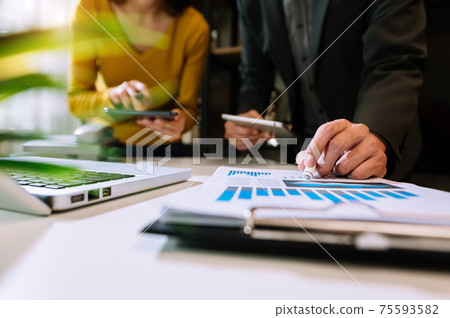 Businessman making presentation with his colleagues and business tablet digital computer at office  75593582