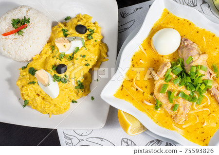 Chicken soup and aji de gallina, Peruvian traditional food Chicken soup and aji de gallina, Peruvian traditional food 75593826