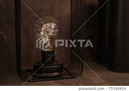 Edison lighbulb on a stand. One old decorative lamp for loft Edison lighbulb on a stand. One old decorative lamp for loft 75598924