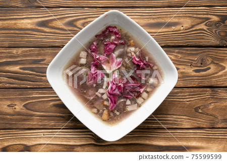 Broth with bacon and radicchio salad Broth with bacon and radicchio salad 75599599
