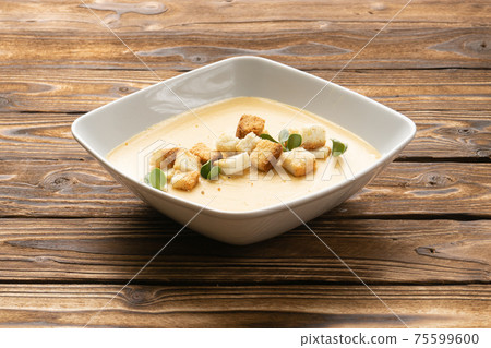 Vegan pumpkin cream soup with croutons Vegan pumpkin cream soup with croutons 75599600