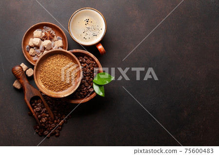 Roasted coffee beans, ground powder and espresso cup Roasted coffee beans, ground powder and espresso cup 75600483