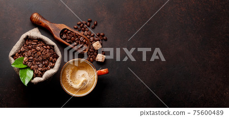 Roasted coffee beans, brown sugar and espresso cup Roasted coffee beans, brown sugar and espresso cup 75600489