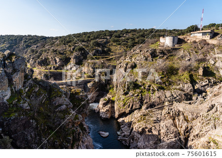 View of the dam of El VIllar a sunny day in Madrid, Spain 75601615