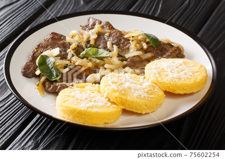 Venetian style calf liver fegato alla Veneziana closeup in the plate. Horizontal Venetian style calf liver fegato alla Veneziana closeup in the plate. Horizontal 75602254