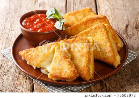Mozzarella in Carrozza Golden Grilled Cheese Sandwiches closeup in the plate. horizontal Mozzarella in Carrozza Golden Grilled Cheese Sandwiches closeup in the plate. horizontal 75602978