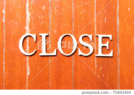 Alphabet letter in word close on old red color wood plate background Alphabet letter in word close on old red color wood plate background 75603409