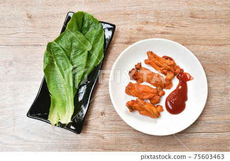 roasted barbecue chicken rib with honey sauce dipping ketchup on plate eat couple fresh cos vegetable salad roasted barbecue chicken rib with honey sauce dipping ketchup on plate eat couple fresh cos vegetable salad 75603463