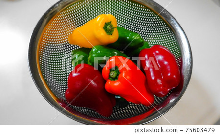 Colorful red, green and yellow paprika in a stainless steel bowl 4118 Colorful red, green and yellow paprika in a stainless steel bowl 4118 75603479