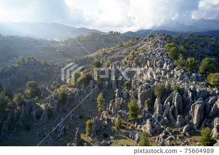 Breathtaking landscape of rock formations and mountains. Breathtaking landscape of rock formations and mountains. 75604989