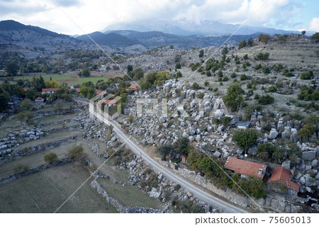 Scenic panoramic view of village in mountain valley. 75605013