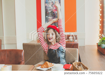 Beautiful woman smiling feeling so happy and relaxing in cafe 75605822