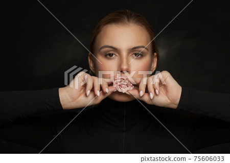 Perfect woman with rose flower on black background Perfect woman with rose flower on black background 75606033