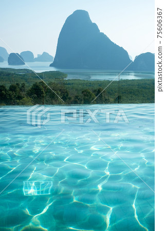 luxury pool hotel against Phang Nga bay background, Tourist relaxing at Samet Nang She, near Phuket in Southern Thailand. travel, trip and summer vacation 75606367