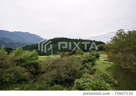 Countryside mountain scenery and electric wires 75607110