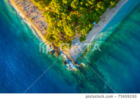 Mediterranean sea. Aerial view on the beach and people. Beach and blue water. Mediterranean sea. Aerial view on the beach and people. Beach and blue water. 75609288