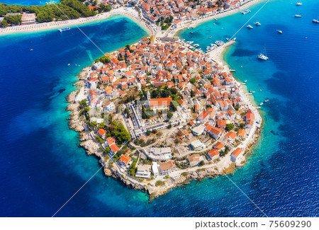 Primosten town, Croatia. View of the city from the air. Seascape with beach and old town. Primosten town, Croatia. View of the city from the air. Seascape with beach and old town. 75609290