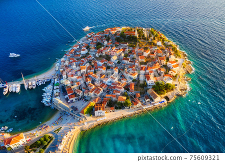 Primosten town, Croatia. View of the city from the air. Seascape with beach and old town. Primosten town, Croatia. View of the city from the air. Seascape with beach and old town. 75609321