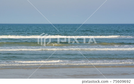 Beautiful view of the surf in New Smyrna Beach on the Atlantic Ocean, Volusia County, Florida Beautiful view of the surf in New Smyrna Beach on the Atlantic Ocean, Volusia County, Florida 75609692