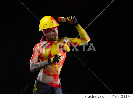 the man is a builder a painter a plasterer all in paint with a brush and a roller the man is a builder a painter a plasterer all in paint with a brush and a roller 75610319