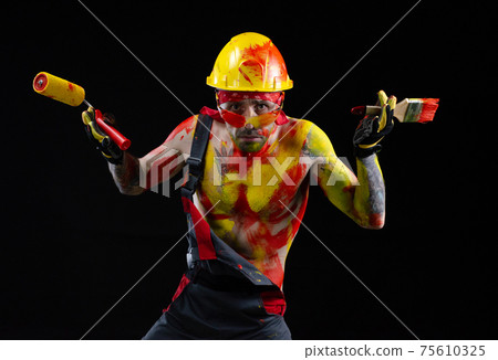 the man is a builder a painter a plasterer all in paint with a brush and a roller the man is a builder a painter a plasterer all in paint with a brush and a roller 75610325