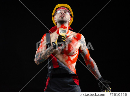 the man is a builder a painter a plasterer all in paint with a brush and a roller the man is a builder a painter a plasterer all in paint with a brush and a roller 75610336
