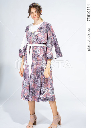 Young white woman isolated on light grey 75610534