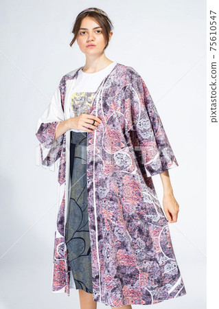 Young white woman isolated on light grey 75610547