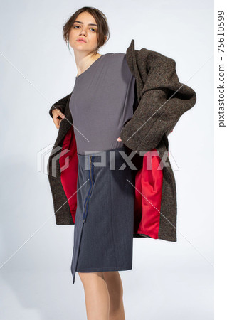 Young white girl on light grey 75610599