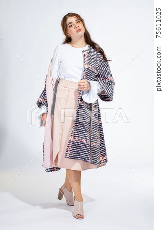Young white woman isolated on light grey Young white woman isolated on light grey 75611025