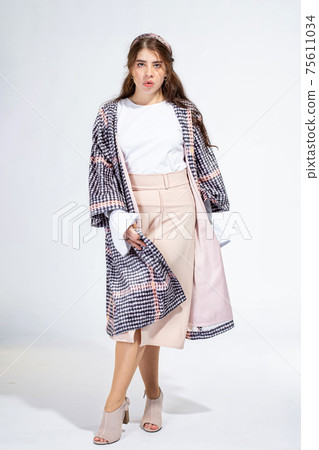 Young white woman isolated on light grey Young white woman isolated on light grey 75611034