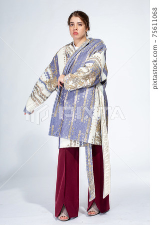 Young white girl on light grey 75611068
