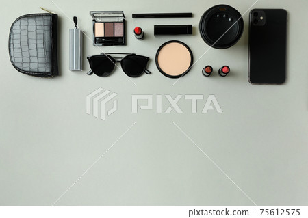 Beauty concept with makeup cosmetics on gray background Beauty concept with makeup cosmetics on gray background 75612575