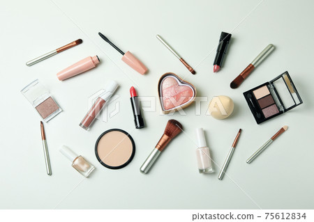 Different makeup cosmetics on white background, top view Different makeup cosmetics on white background, top view 75612834