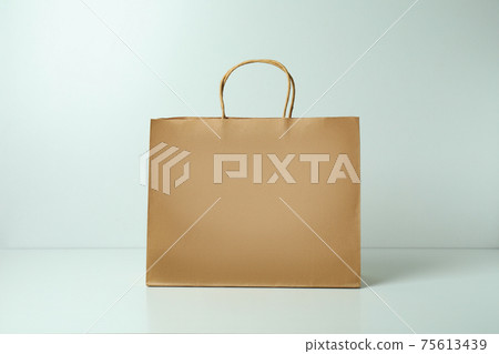 Blank paper bag on white background, space for text 75613439
