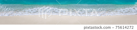 Sea waves with foam on white tropical beach. Long banner. 75614272
